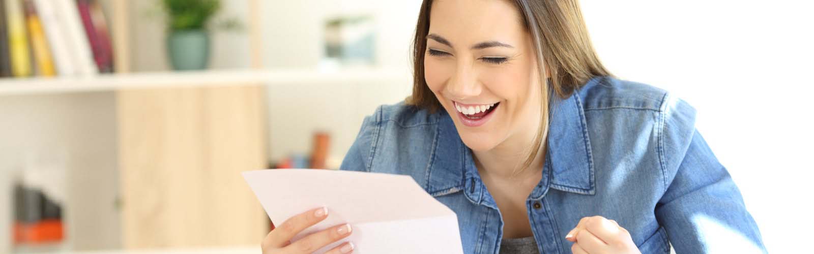 Female student reading acceptance letter