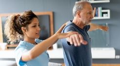 Female physical therapist working with patient