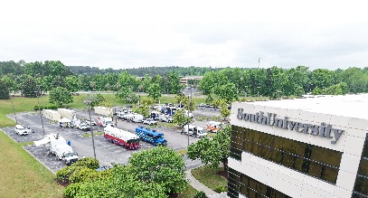 south university school building with disaster relief vehicles parked in the parkling lot for a training event