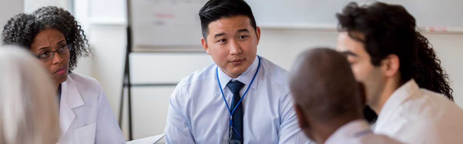 Healthcare professional meeting with doctors