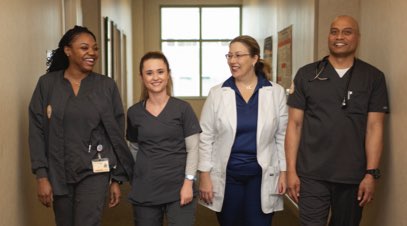 Group of South University students with instructor in hallway-alt-text