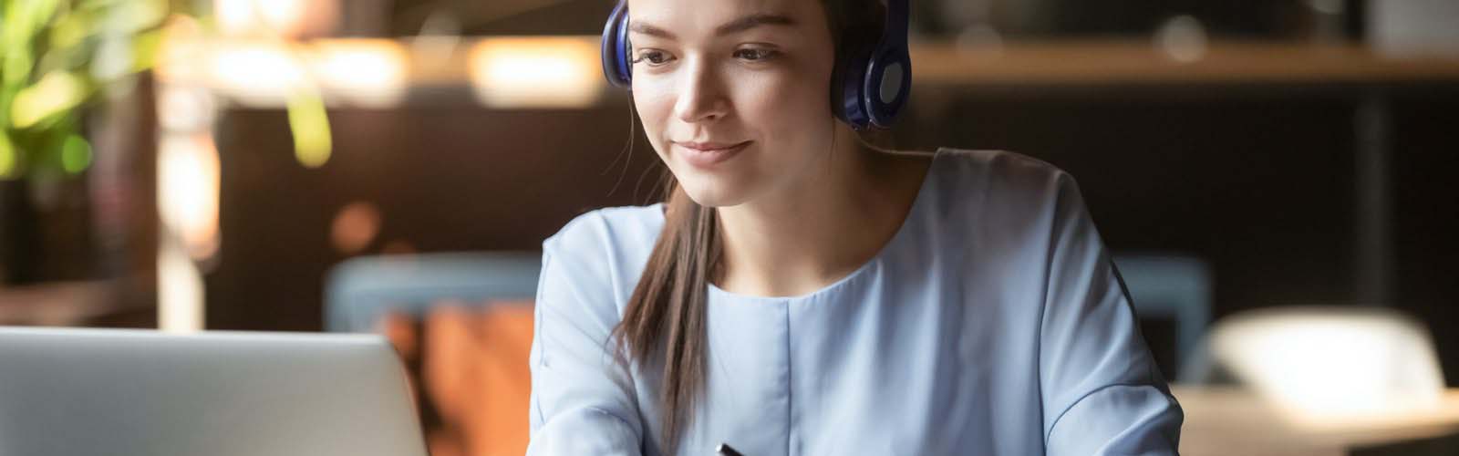 Woman on laptop studying at home